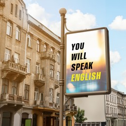 Image of You Will Speak English text on advertising board in city. Language course