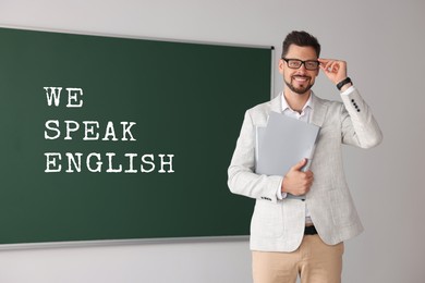 Image of Teacher near green chalkboard with text We Speak English. Language course