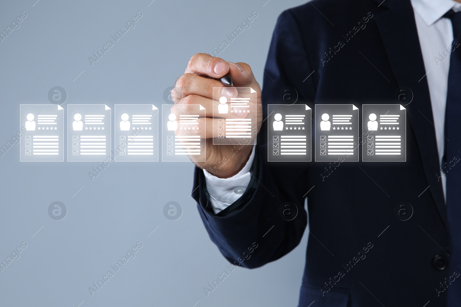 Human resources manager checking candidate's resume on virtual screen against grey background, closeup Image of Human resources manager checking candidate's resume on virtual screen against grey background, closeup