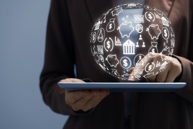 Image of Woman using tablet computer on grey background, closeup. Virtual globe with icons over device