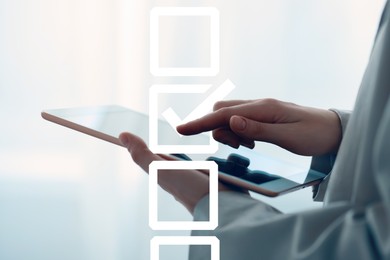 Image of Woman using tablet computer, closeup. Putting tick into checkbox on virtual screen