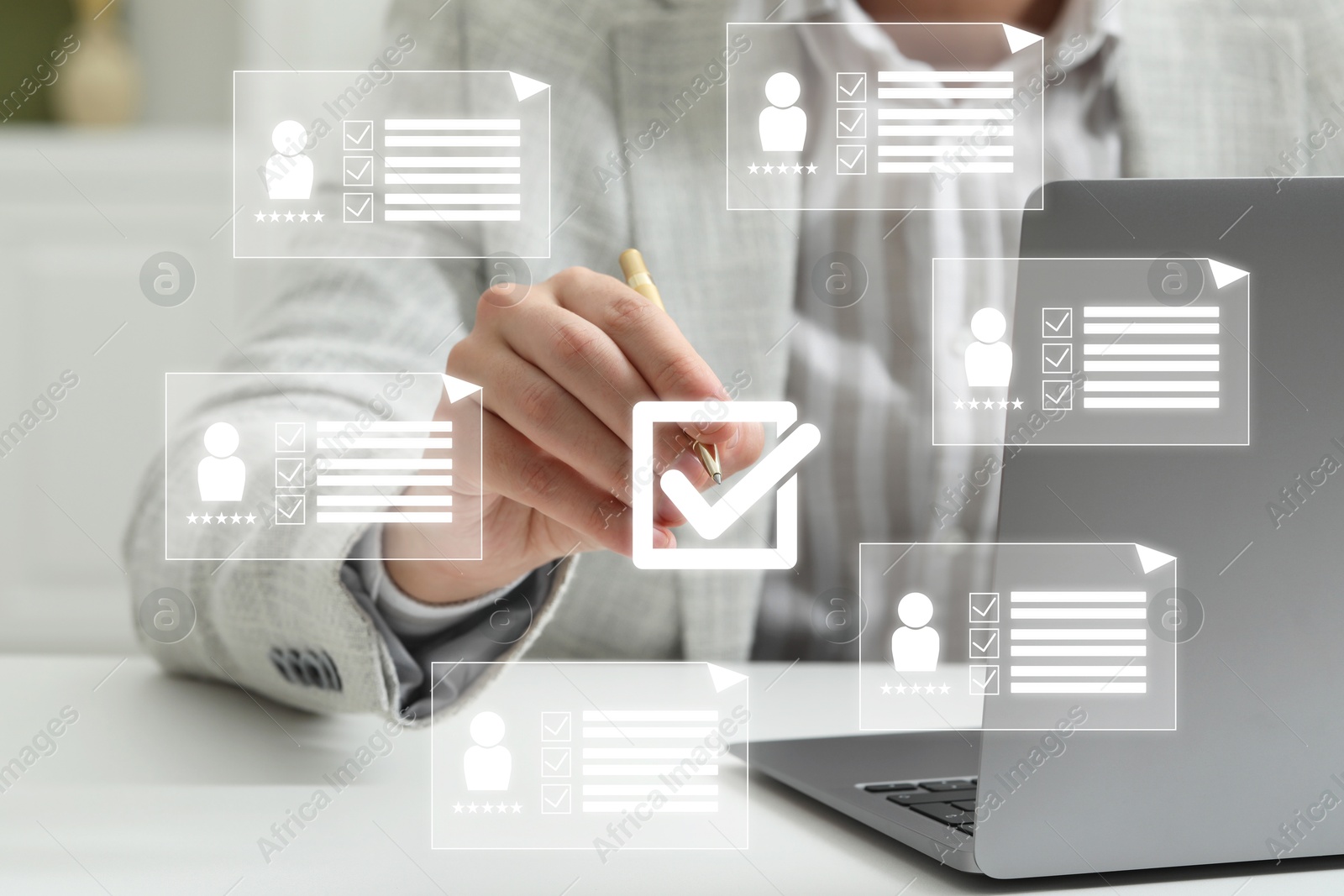 Human resources manager putting check mark on virtual screen with resumes, closeup Image of Human resources manager putting check mark on virtual screen with resumes, closeup