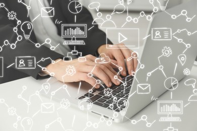 Image of Woman working on laptop at table, closeup. Scheme with icons on virtual screen