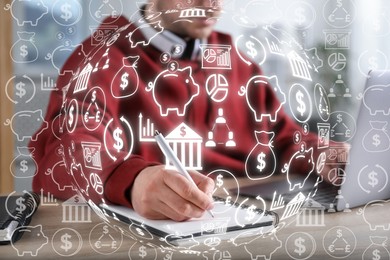 Image of Man working on laptop at table, closeup. Virtual icons