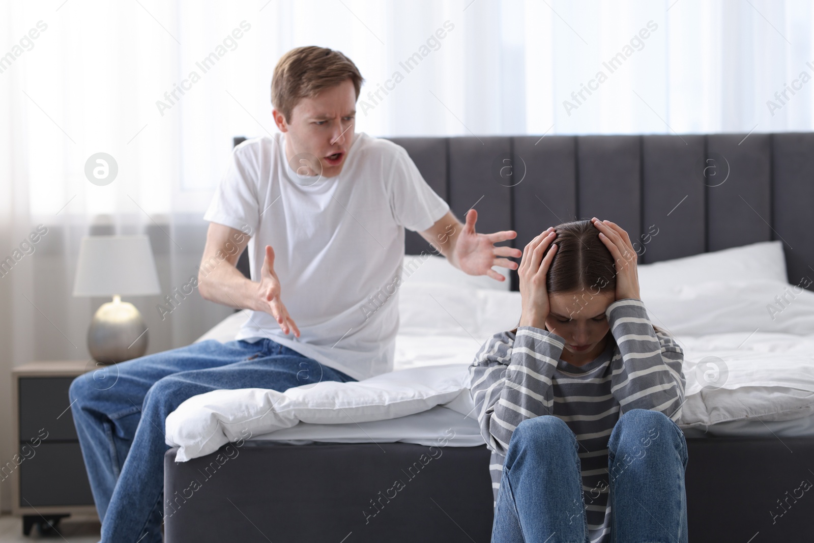 Photo of Woman and man having quarrel at home