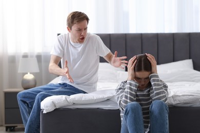 Photo of Woman and man having quarrel at home