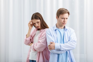 Photo of Woman and man having quarrel at home