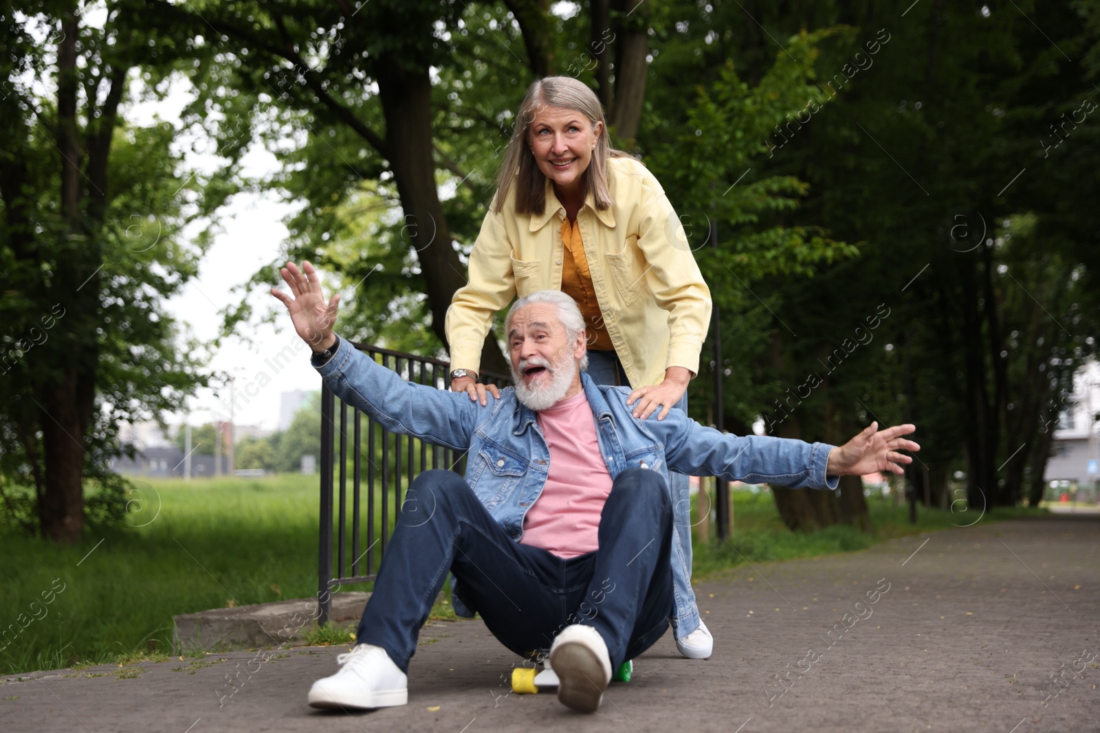 Photo of Lovely senior couple having fun together in park