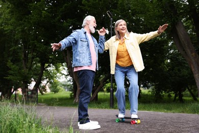 Photo of Lovely senior couple having fun together in park