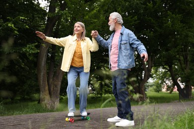 Photo of Lovely senior couple having fun together in park