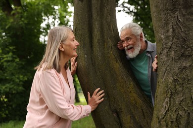 Photo of Lovely senior couple near tree in park