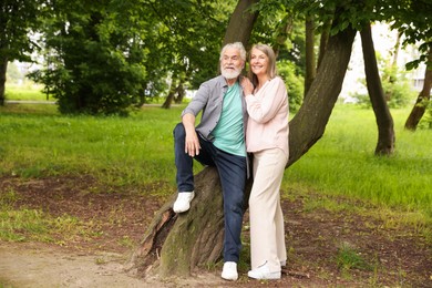 Photo of Lovely senior couple near tree in park