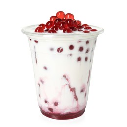 Photo of Tasty milk bubble tea in plastic cup isolated on white