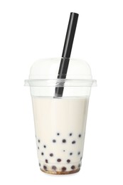 Photo of Tasty milk bubble tea in plastic cup isolated on white