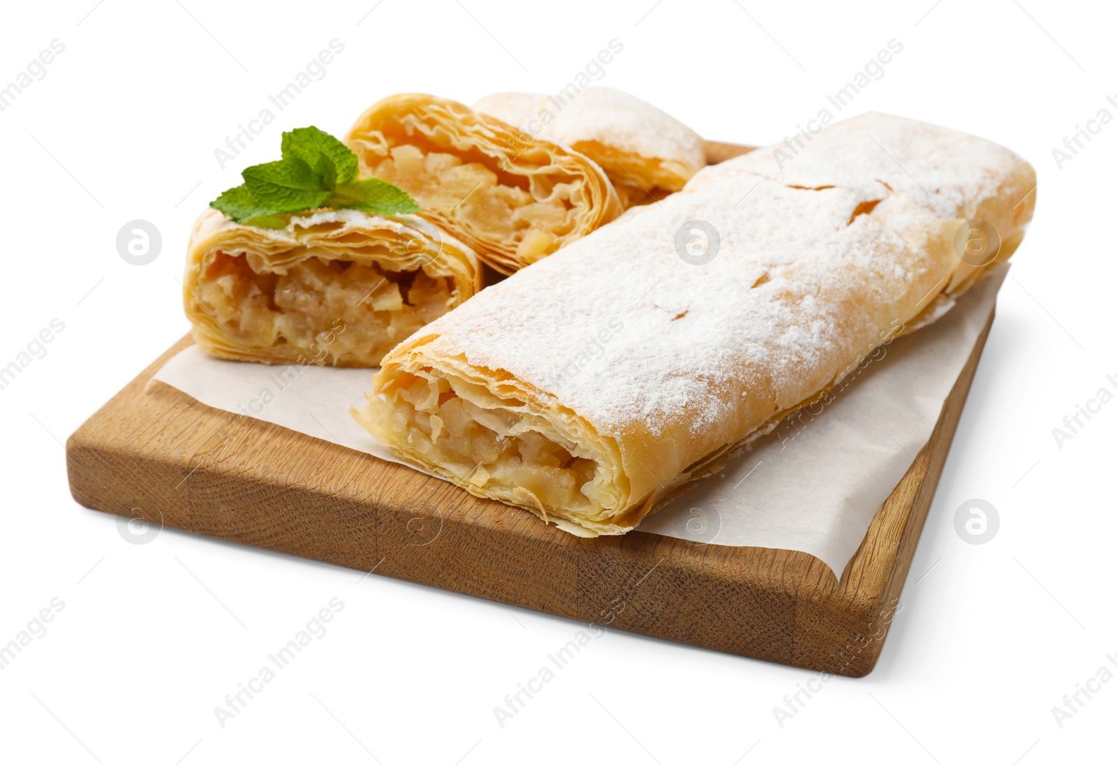 Tasty apple strudels with powdered sugar and mint isolated on white Photo of Tasty apple strudels with powdered sugar and mint isolated on white