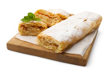 Photo of Tasty apple strudels with powdered sugar and mint isolated on white