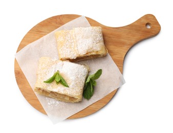 Photo of Pieces of tasty apple strudel with powdered sugar and mint isolated on white, top view