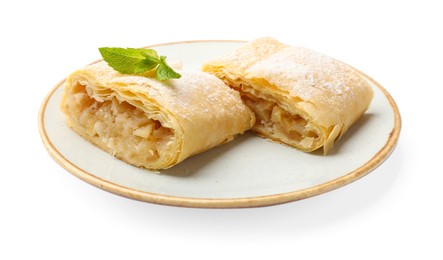 Photo of Pieces of tasty apple strudel with powdered sugar and mint isolated on white