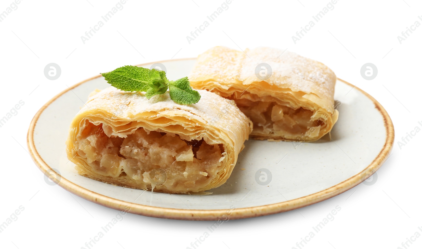 Pieces of tasty apple strudel with powdered sugar and mint isolated on white Photo of Pieces of tasty apple strudel with powdered sugar and mint isolated on white