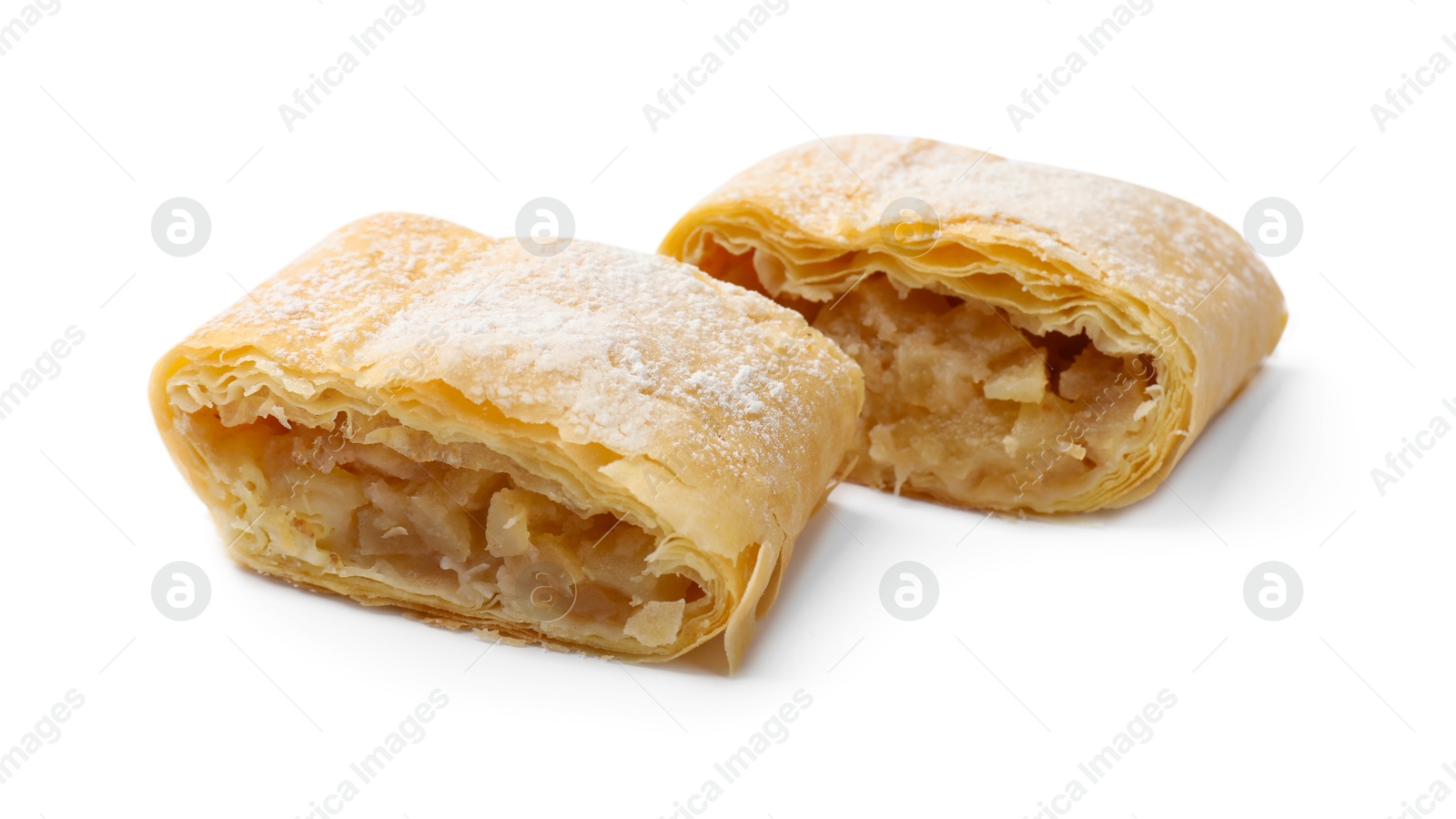 Pieces of tasty apple strudel with powdered sugar isolated on white Photo of Pieces of tasty apple strudel with powdered sugar isolated on white