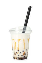 Photo of Tasty milk bubble tea in plastic cup isolated on white