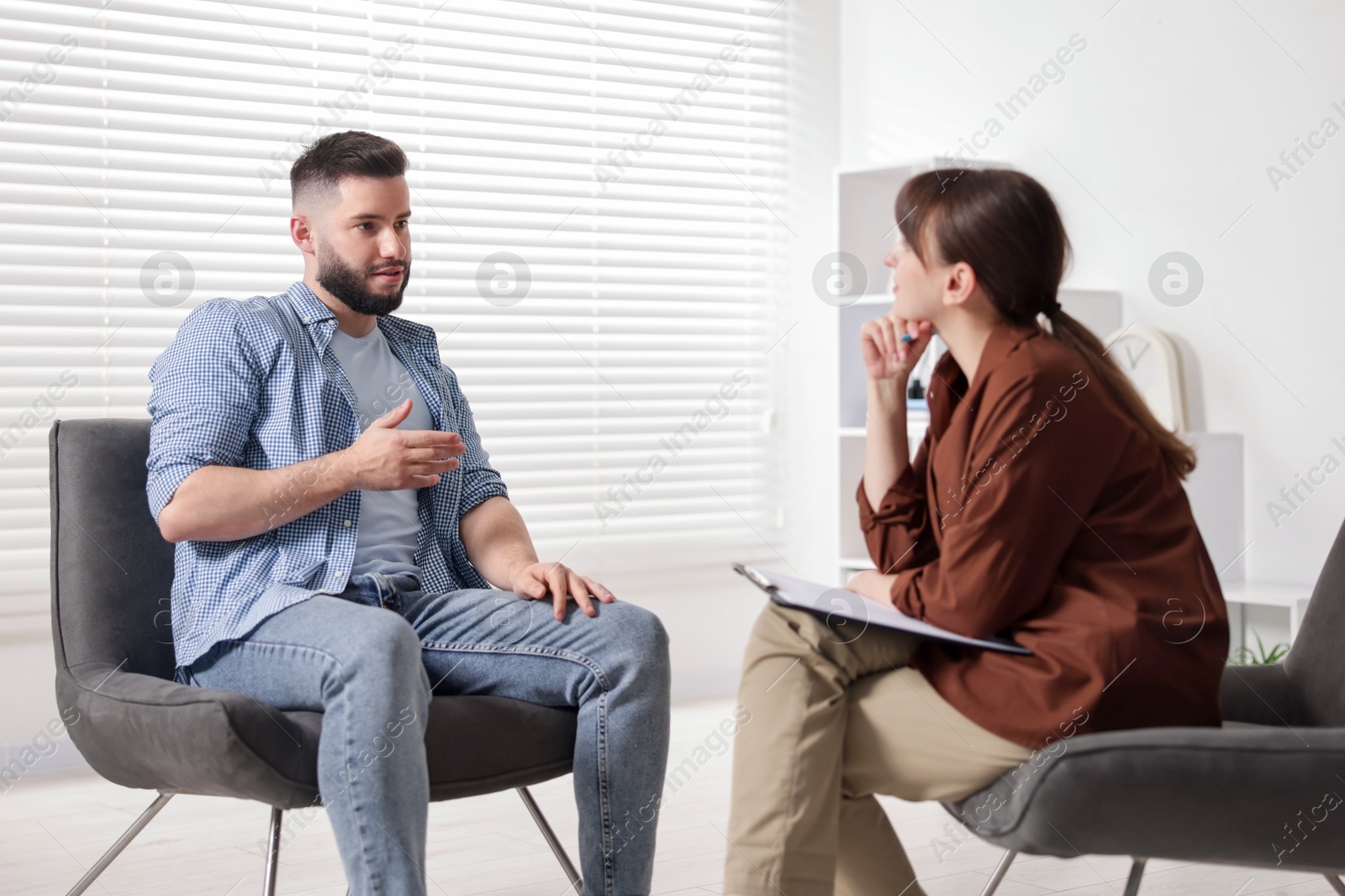 Professional psychologist working with patient in office Photo of Professional psychologist working with patient in office