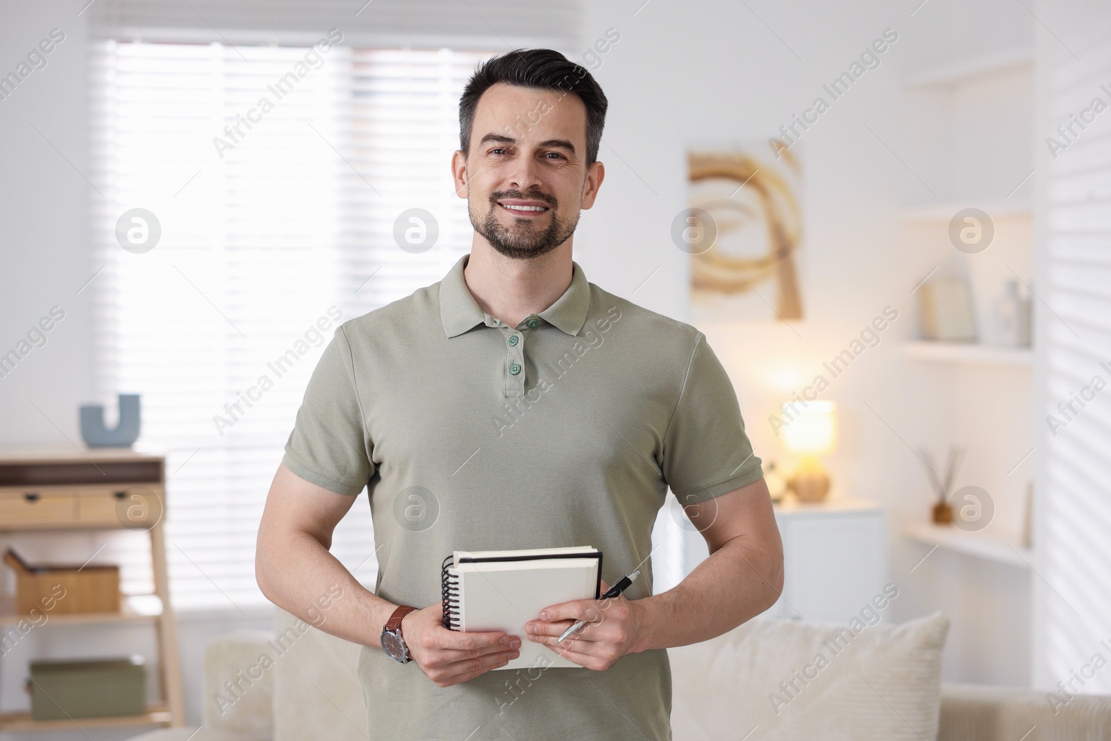 Professional psychologist with notebook in his office Photo of Professional psychologist with notebook in his office