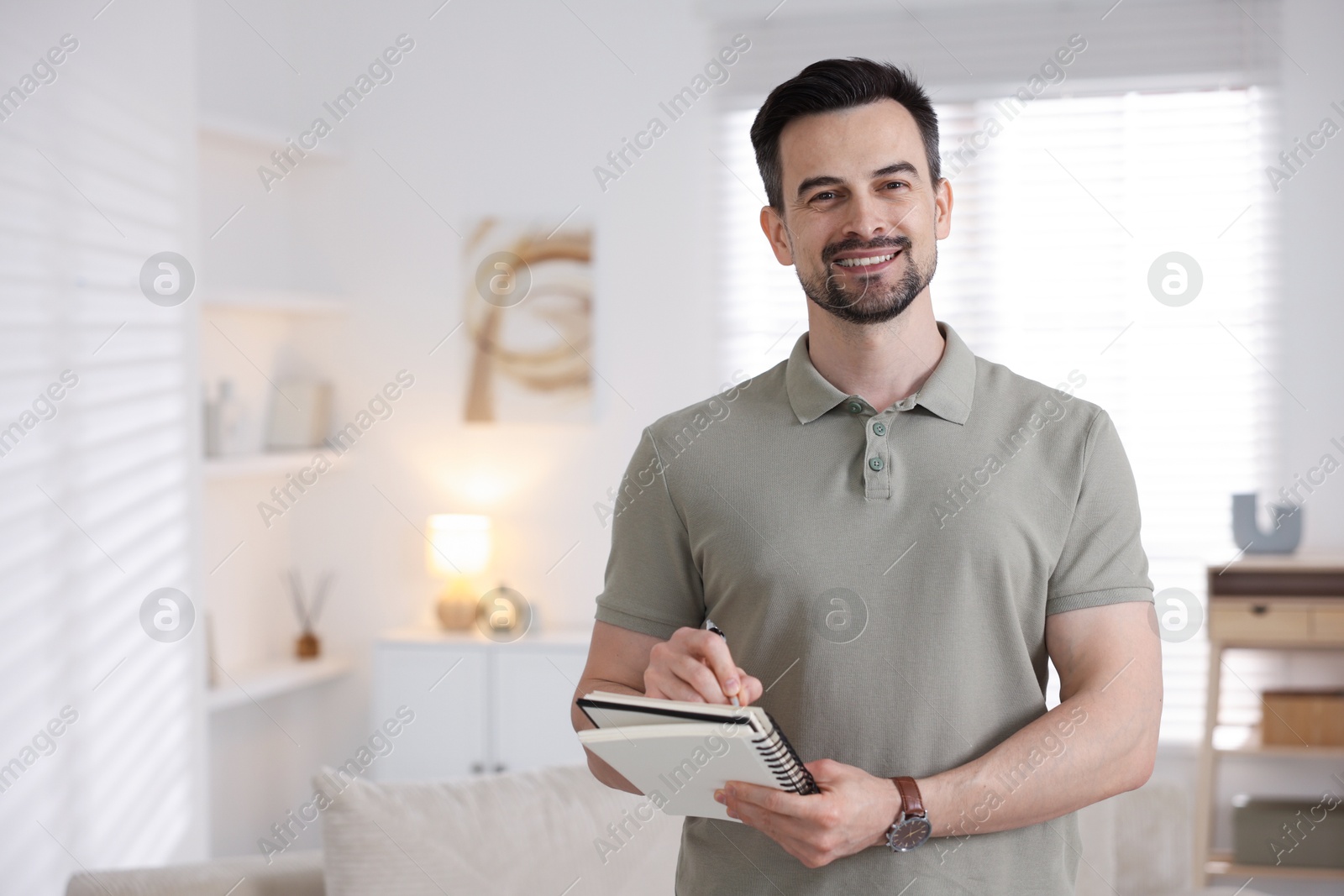 Professional psychologist with notebook in his office. Space for text Photo of Professional psychologist with notebook in his office. Space for text