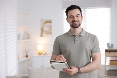 Photo of Professional psychologist with notebook in his office. Space for text