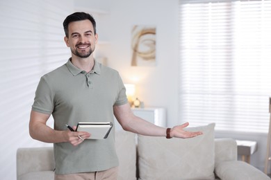 Photo of Professional psychologist with notebook inviting to his office. Space for text