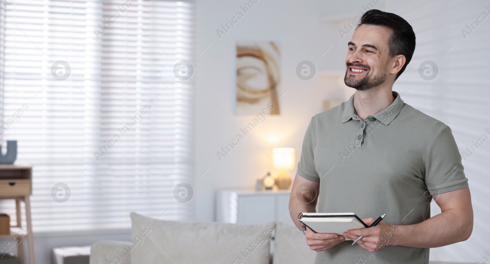 Professional psychologist with notebook in his office. Space for text Photo of Professional psychologist with notebook in his office. Space for text