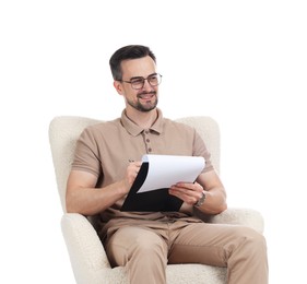 Photo of Professional psychologist with clipboard in armchair on white background