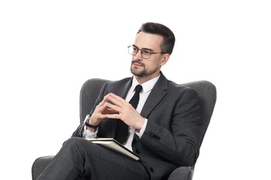 Photo of Professional psychologist with notebook in armchair on white background