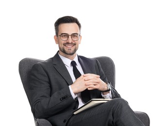 Photo of Professional psychologist with notebook in armchair on white background
