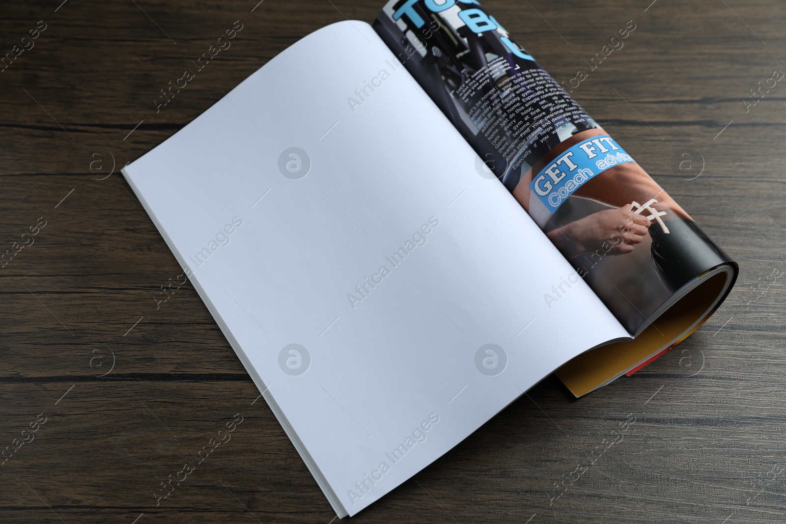 Open magazine on wooden table, above view. Mockup for design Photo of Open magazine on wooden table, above view. Mockup for design