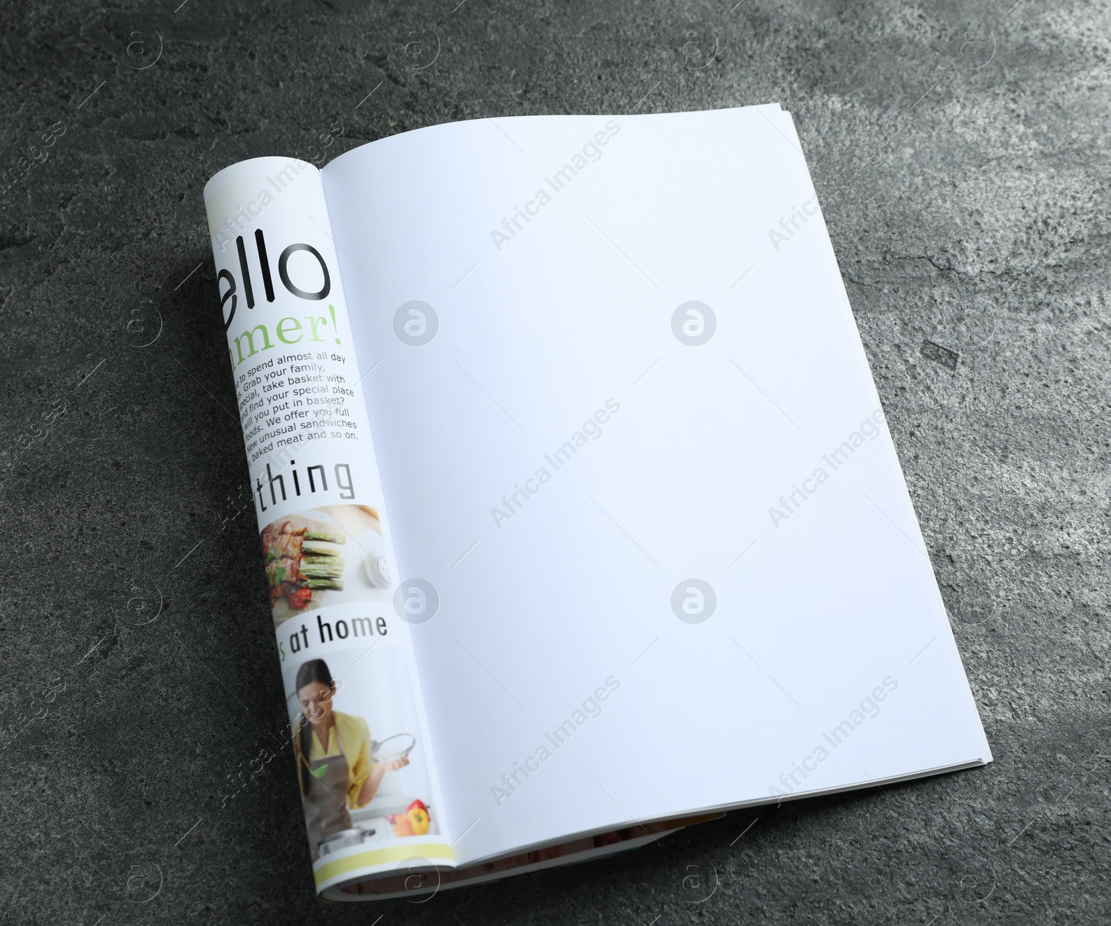 Open magazine on grey table, above view. Mockup for design Photo of Open magazine on grey table, above view. Mockup for design