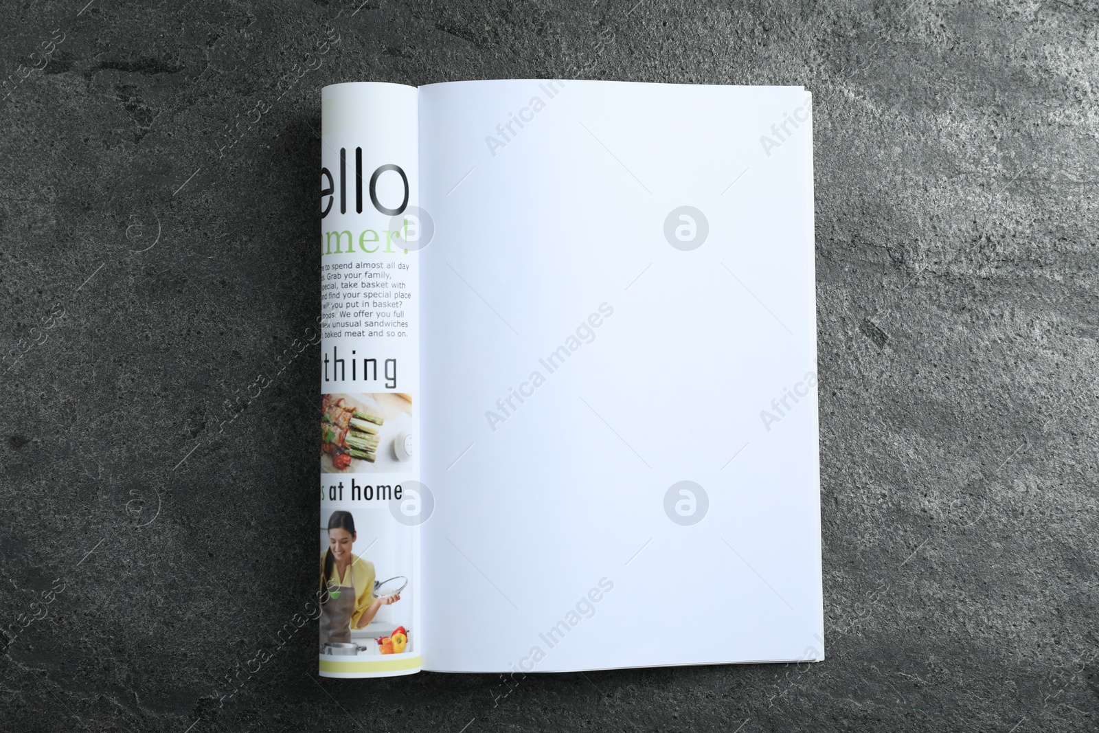Open magazine on grey table, top view. Mockup for design Photo of Open magazine on grey table, top view. Mockup for design