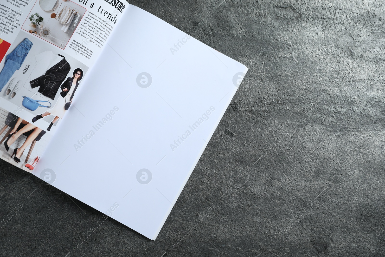 Open magazine on grey table, top view. Mockup for design Photo of Open magazine on grey table, top view. Mockup for design