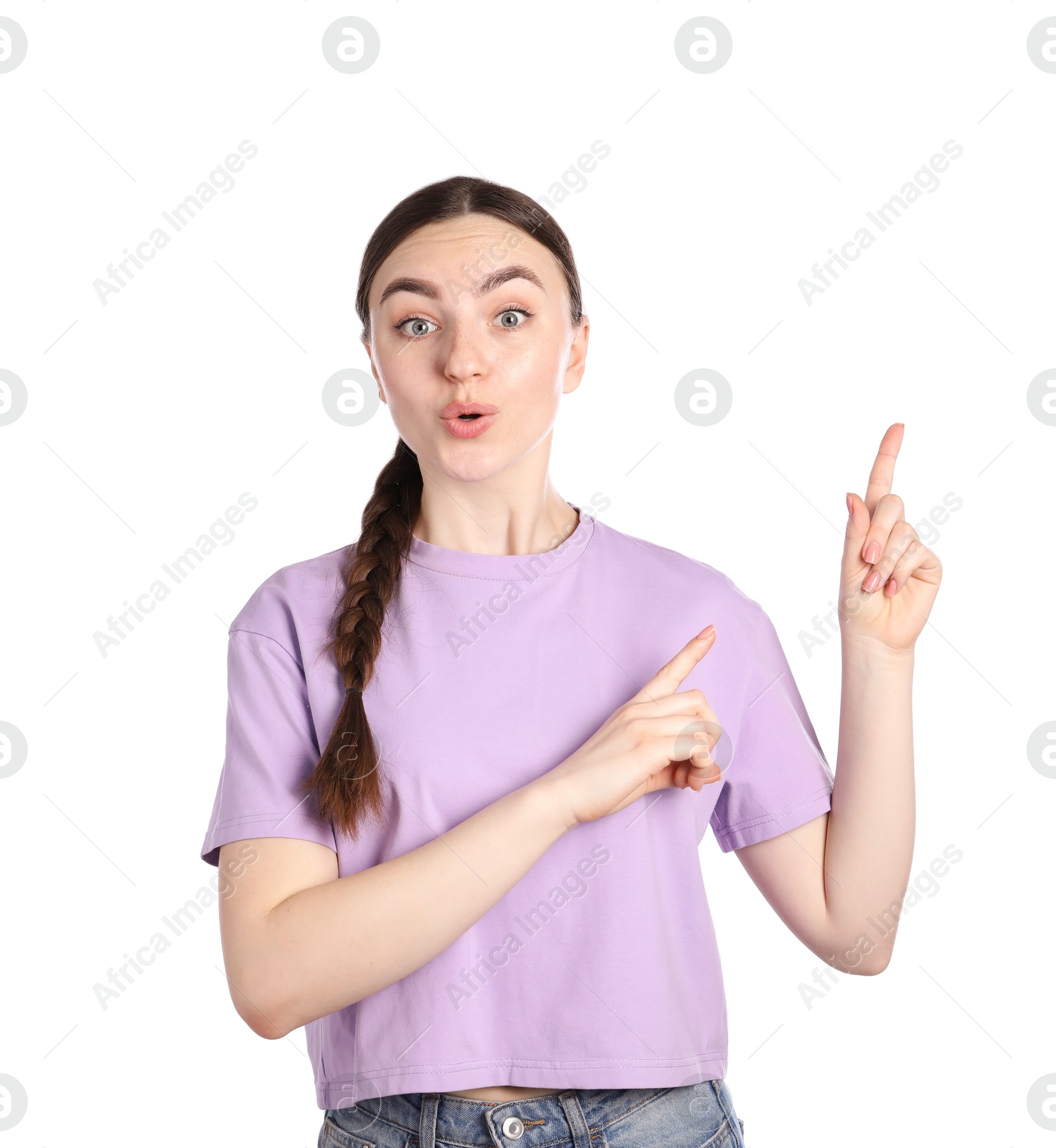 Surprised woman pointing at something on white background Photo of Surprised woman pointing at something on white background