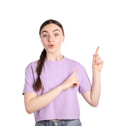 Photo of Surprised woman pointing at something on white background