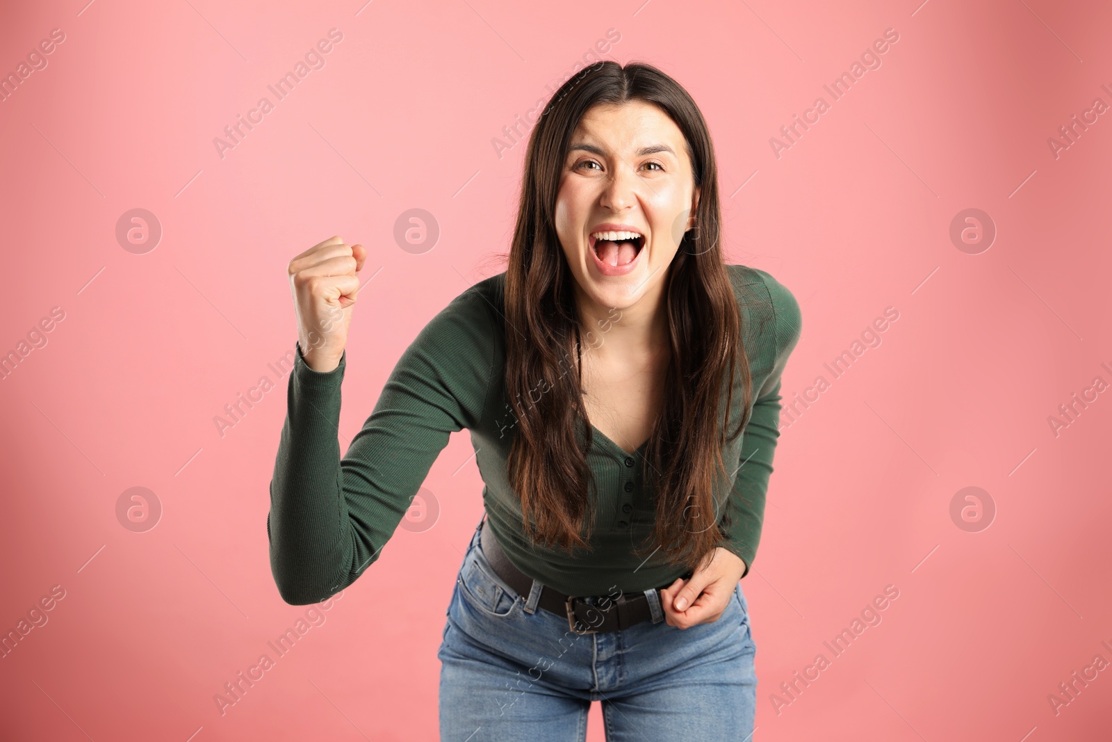 Portrait of emotional woman on pink background Photo of Portrait of emotional woman on pink background