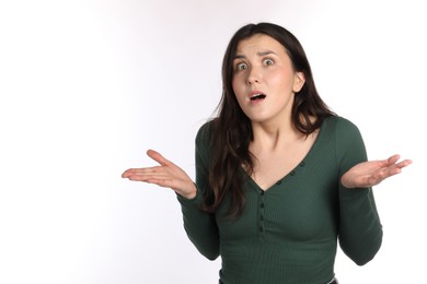 Photo of Portrait of confused woman on white background
