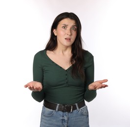 Photo of Portrait of confused woman on white background