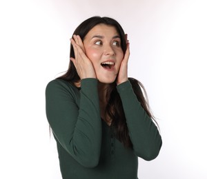 Photo of Portrait of surprised woman on white background