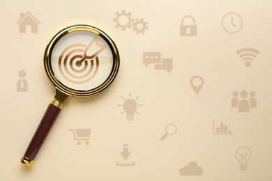Image of Magnifying glass over target with arrow on beige background, top view. Different icons around