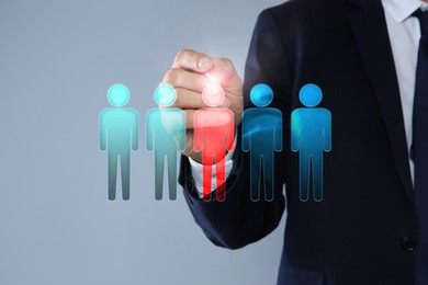 Image of Dismissal. Businessman choosing human figure on virtual screen against grey background, closeup
