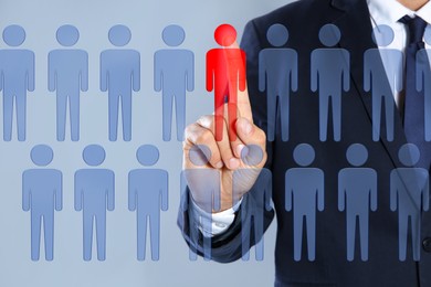 Image of Dismissal. Businessman choosing human figure on virtual screen against grey background, closeup