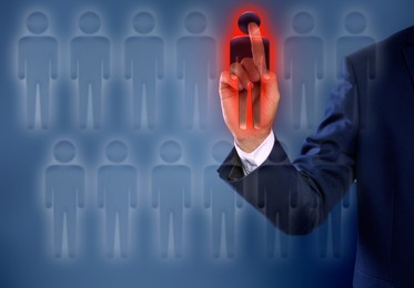 Image of Dismissal. Businessman choosing human figure on virtual screen against dark blue background, closeup