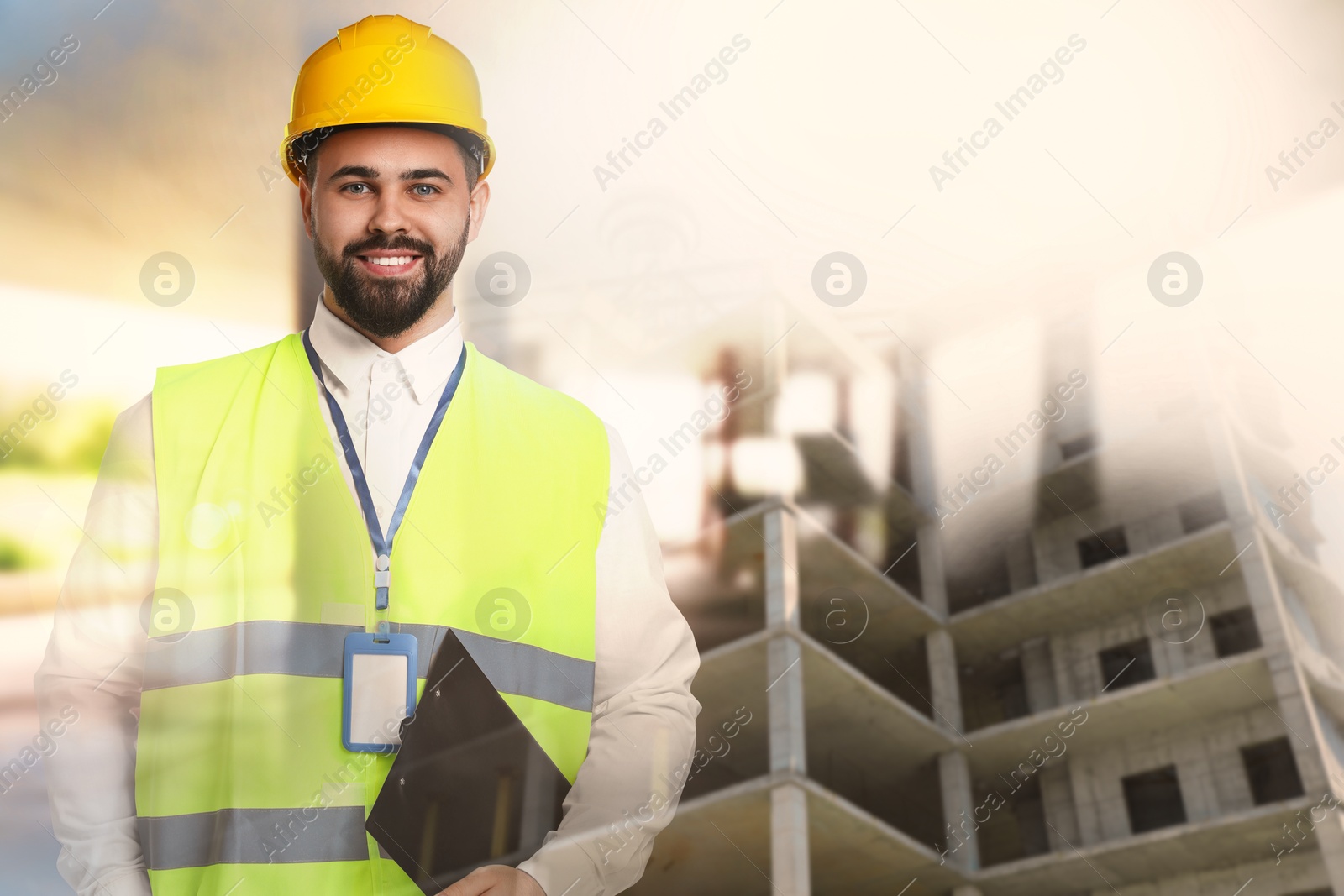 Engineer with clipboard and unfinished building, double exposure Image of Engineer with clipboard and unfinished building, double exposure