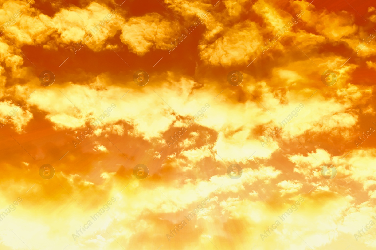 Image of Orange sky with clouds during hot summer weather